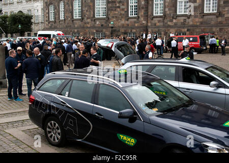 Copenhagen, Denmark. 16th September, 2015. Copenhagen Taxi drivers demonstrate against Uber in front of the Danish Parliament. They claimed that Uber offer their service in violation of the law regarding Taxi driving and that Uber drivers don’t pay tax. Credit:  OJPHOTOS/Alamy Live News Stock Photo