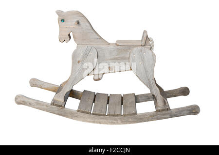 Old vintage wooden rocking horse . wood has aged to a gray tone. Stock Photo