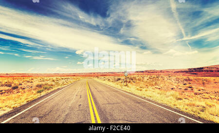 Retro vintage old film style endless country highway in USA, travel adventure concept. Stock Photo