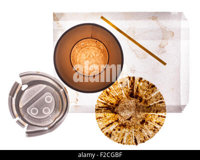 overhead view of empty paper coffee cup, lid, empty muffin wrapper, stir stick, white paper bag Stock Photo