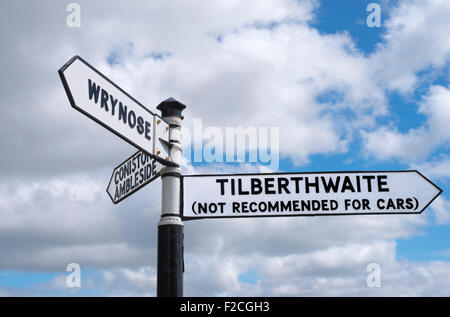 Road sign in Little Langdale, Lake District National Park, England, pointing to Wrynose , Tilberthwait, Ambleside and Coniston. Stock Photo