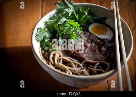 Kogashi miso ramen with ground pork belly, shoyu marinated egg, chanterelle mushrooms and shungiku, Stock Photo