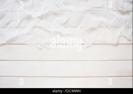 White wooden background with cheesecloth Stock Photo