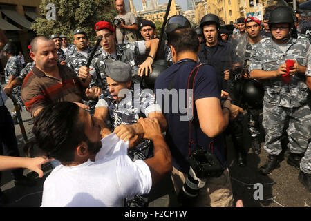 Beirut, Beirut, Lebanon. 16th Sep, 2015. Lebanese activists from 'You Stink' campaign clash with riot police after a protest against today s session of a dialogue of top political figures, accused by the group of failing to resolve a crisis over rubbish building up in the streets, in downtown Beirut on September 16, 2015 Credit:  Marwan Tahtah/APA Images/ZUMA Wire/Alamy Live News Stock Photo