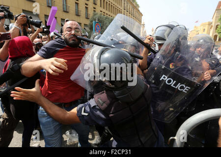 Beirut, Beirut, Lebanon. 16th Sep, 2015. Lebanese activists from 'You Stink' campaign clash with riot police after a protest against today s session of a dialogue of top political figures, accused by the group of failing to resolve a crisis over rubbish building up in the streets, in downtown Beirut on September 16, 2015 Credit:  Marwan Tahtah/APA Images/ZUMA Wire/Alamy Live News Stock Photo