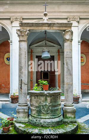 Courtyard and well outside the church of Saint Agata of Goti, Rome, Italy Stock Photo