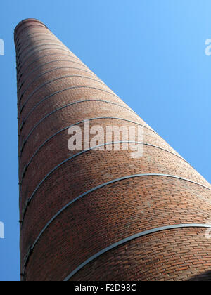 Brick pipe against blue sky Stock Photo