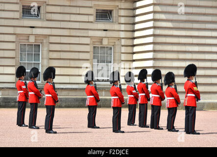 LONDON, UK - JUNE 12, 2014: British Royal guards perform the Changing of the Guard in Buckingham Palace