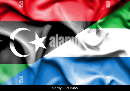 Waving flag of Sierra Leone and Libya Stock Photo