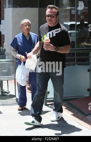 Tom Arnold seen leaving a cafe in Beverly Hills with a drink and some food to go.  Featuring: Tom Arnold Where: Los Angeles, California, United States When: 16 Jul 2015 Stock Photo