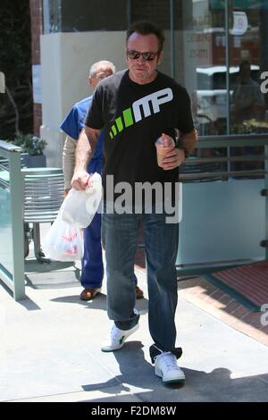 Tom Arnold seen leaving a cafe in Beverly Hills with a drink and some food to go.  Featuring: Tom Arnold Where: Los Angeles, California, United States When: 16 Jul 2015 Stock Photo