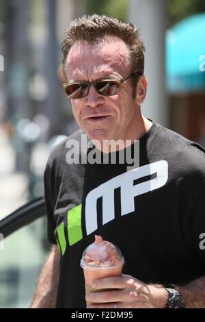 Tom Arnold seen leaving a cafe in Beverly Hills with a drink and some food to go.  Featuring: Tom Arnold Where: Los Angeles, California, United States When: 16 Jul 2015 Stock Photo