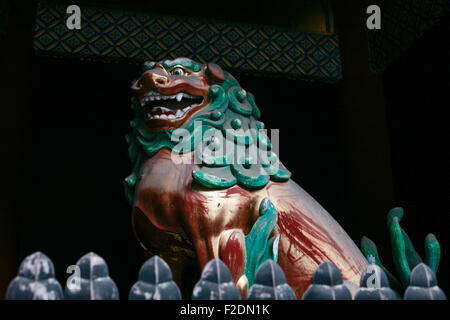 Green gold red shrine temple guardian dog Stock Photo