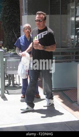 Tom Arnold seen leaving a cafe in Beverly Hills with a drink and some food to go.  Featuring: Tom Arnold Where: Los Angeles, California, United States When: 16 Jul 2015 Stock Photo