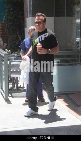 Tom Arnold seen leaving a cafe in Beverly Hills with a drink and some food to go.  Featuring: Tom Arnold Where: Los Angeles, California, United States When: 16 Jul 2015 Stock Photo