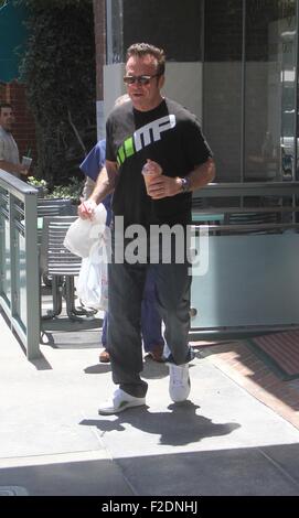 Tom Arnold seen leaving a cafe in Beverly Hills with a drink and some food to go.  Featuring: Tom Arnold Where: Los Angeles, California, United States When: 16 Jul 2015 Stock Photo