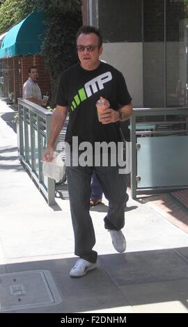 Tom Arnold seen leaving a cafe in Beverly Hills with a drink and some food to go.  Featuring: Tom Arnold Where: Los Angeles, California, United States When: 16 Jul 2015 Stock Photo