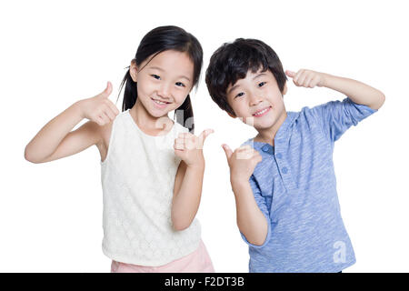 Happy children doing thumbs up Stock Photo