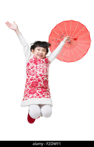 Happy girl jumping with a paper umbrella Stock Photo