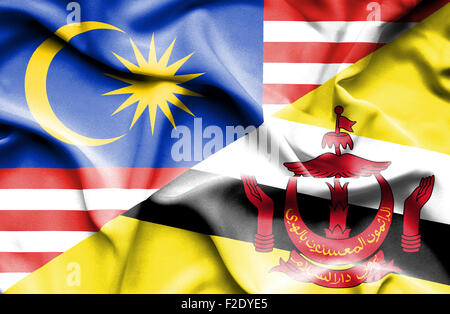 Waving flag of Brunei and Malaysia Stock Photo