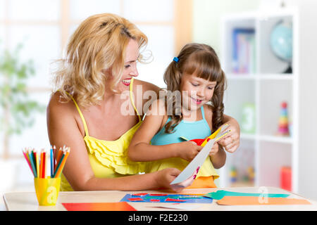 mother and daughter play doing handcraft Stock Photo