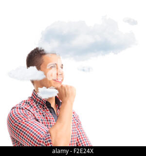 Young pensive man thinking with his head in clouds isolated on white background Stock Photo