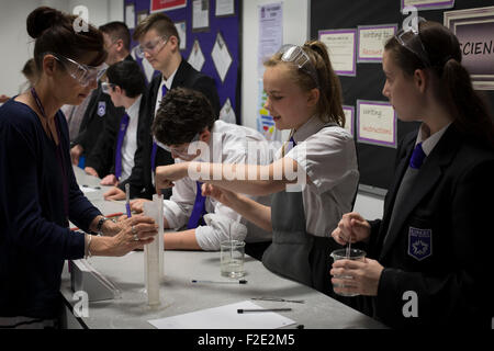 Pupils pictured during a Year 9 science class at Kirkby High School, Merseyside. The school had one of the lowest success rates for GCHE passes in 2014 in England. In 2013 the school changed from local authority to Academy status. Stock Photo