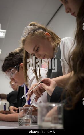 Pupils pictured during a Year 9 science class at Kirkby High School, Merseyside. The school had one of the lowest success rates for GCHE passes in 2014 in England. In 2013 the school changed from local authority to Academy status. Stock Photo