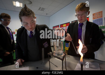 Pupils pictured during a Year 9 science class at Kirkby High School, Merseyside. The school had one of the lowest success rates for GCHE passes in 2014 in England. In 2013 the school changed from local authority to Academy status. Stock Photo