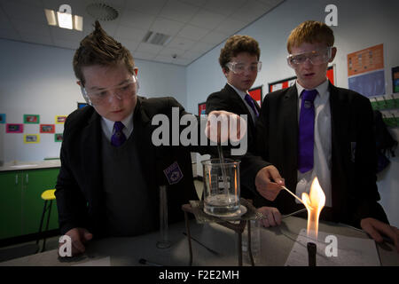 Pupils pictured during a Year 9 science class at Kirkby High School, Merseyside. The school had one of the lowest success rates for GCHE passes in 2014 in England. In 2013 the school changed from local authority to Academy status. Stock Photo