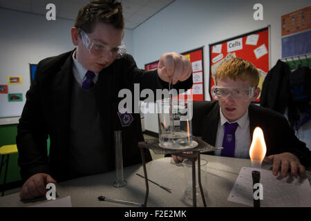 Pupils pictured during a Year 9 science class at Kirkby High School, Merseyside. The school had one of the lowest success rates for GCHE passes in 2014 in England. In 2013 the school changed from local authority to Academy status. Stock Photo