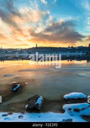 Kiev/Ukraine - January 07, 2015 -The Dnieper river is frozen. Fishermen are waiting to catch some fish on the crackeling ice Stock Photo