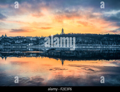 Kiev/Ukraine - January 07, 2015 -The Dnieper river is frozen. Fishermen are waiting to catch some fish on the crackeling ice Stock Photo