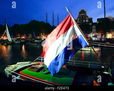 DORDRECHT, NETHERLANDS - JUNE 2 2012: Dordrecht in Steam, the largest steam power event in Europe. Dutch flag flying. Stock Photo