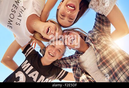 Group of teenagers staying together looking at camera Stock Photo