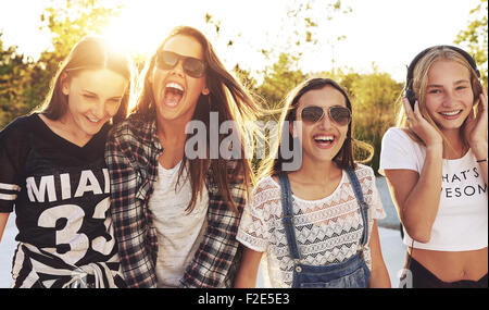 Group of teenagers laughing out loud on s summer day Stock Photo