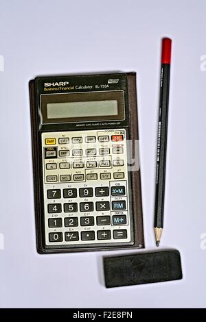 Sharp Business Financial Calculator EL-733A with Black 2B Pencil and Black Eraser Stock Photo