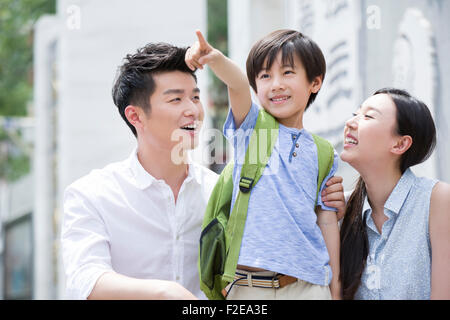 Happy schoolboy with his parents Stock Photo