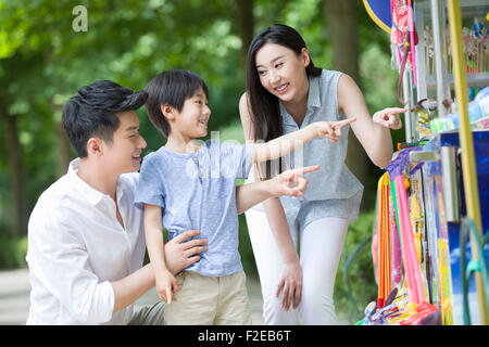 Parents and son buying toys Stock Photo