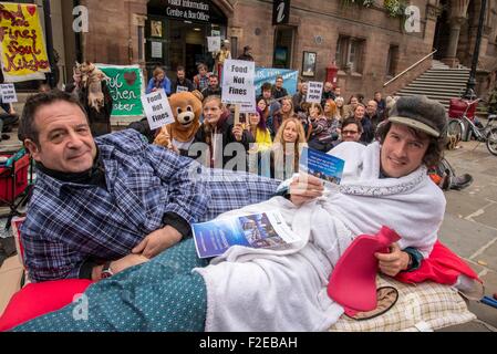 Chester, UK. 17th September, 2015. Left-wing comedian Mark Thomas (left) was in Chester today (Thursday) at a city centre ‘loiterers' event' aimed at protesting against a proposed measure criticised for criminalising rough sleepers. He is pictured with Johhny Walker who is the director of the Keep The Streets Alive campaign. Mark is trying to highlightin a plan to fine homeless people £100 if they lie down or sleep in any public space within a designated zone. This fine can also apply to buskers and people who feed birds. Credit:  Brian Hickey/Alamy Live News Stock Photo