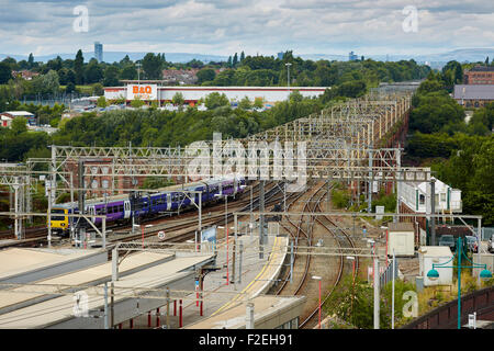 Stockport railway station , looking oiyt towards Manchester with the skyline visible on the horizon including Beetham tower and Stock Photo