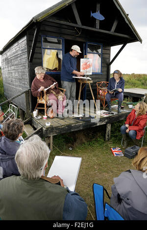 jason bowyer gives mature sdtudents painting technique demonstration Stock Photo