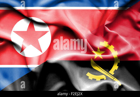 Waving flag of Angola and North Korea Stock Photo