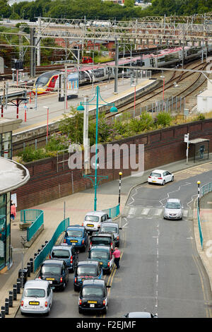 Stockport railway station , looking oiyt towards Manchester with the skyline visible on the horizon including Beetham tower and Stock Photo