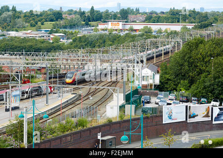 Stockport railway station , looking oiyt towards Manchester with the skyline visible on the horizon including Beetham tower and Stock Photo