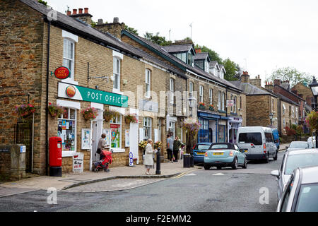 Marple Bridge in Stockport Cheshire, Town Street a local Post office at the heart of this pictures village   Busy independent tr Stock Photo