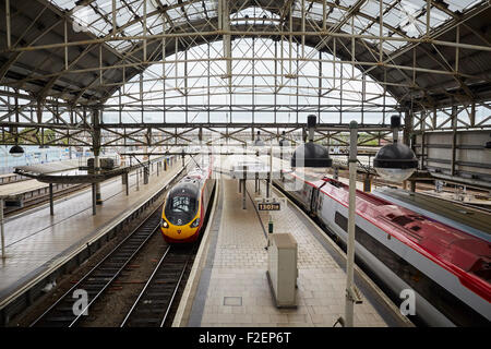 Manchester Piccadilly railway station   Manchester Piccadilly is the principal railway station in Manchester, England. Opened as Stock Photo