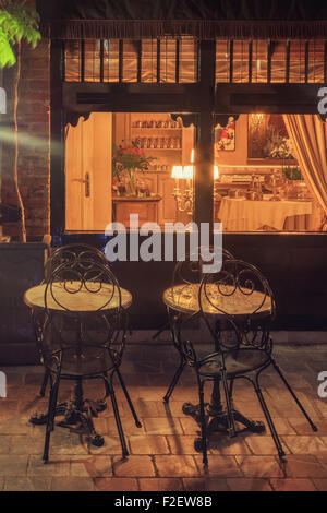 Night view of cozy restaurant in Bruges, Belgium Stock Photo