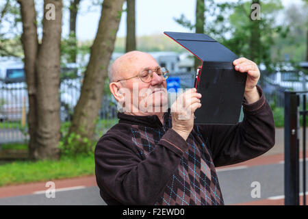 man taking picture photograph with tablet computer Stock Photo