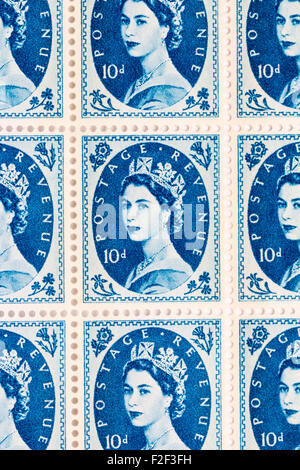 Sheet of 1950's British Royal Mail 10d blue postage stamps from the Wildings definitive issue with portrait of Queen Elizabeth II. Stock Photo